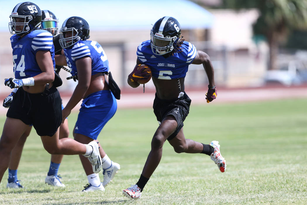 Desert Pines senior running back Cameron Wiley runs the ball during a team practice at Deser ...