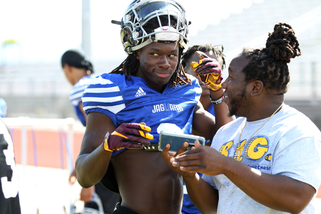 Desert Pines senior running back Cameron Wiley, left, during a team practice at Desert Pines ...