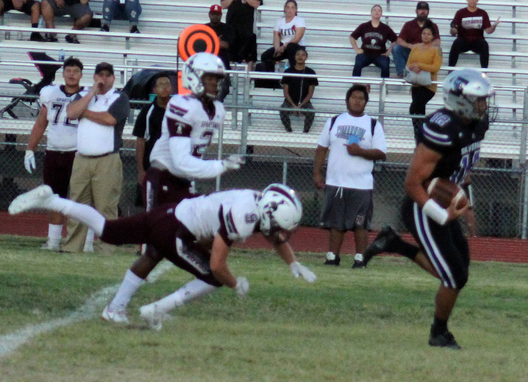 Silverado running back Josh Mendez (12) carries the ball in the first quarter against Cimarr ...