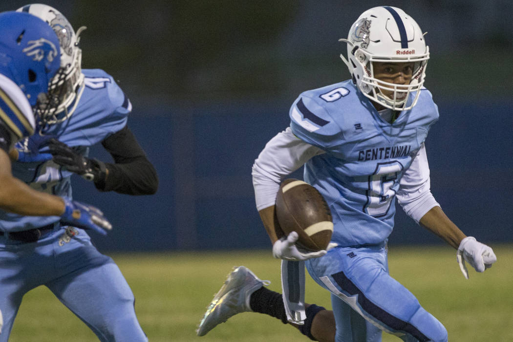 Centennial sophomore wide receiver Gerick Robinson (6) streaks down the sideline in the firs ...