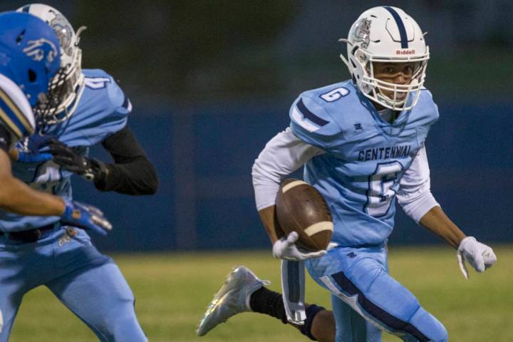 Centennial sophomore wide receiver Gerick Robinson (6) streaks down the sideline in the firs ...