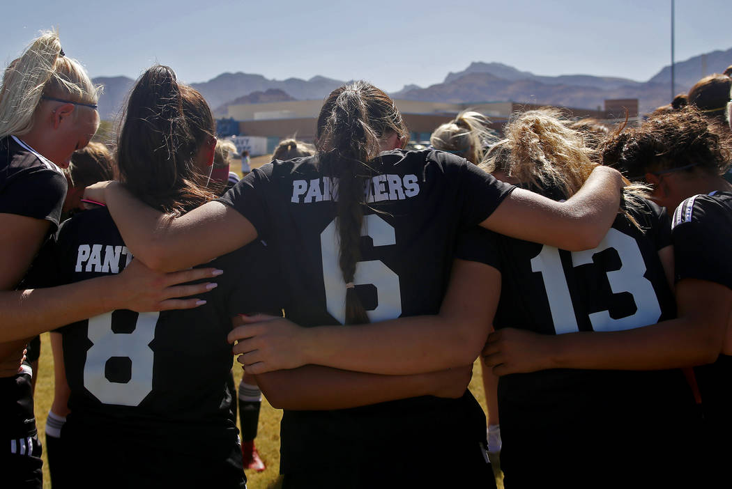 Palo Verde High School’s Holly Lindholm (6) huddles with her team before a game at Cen ...