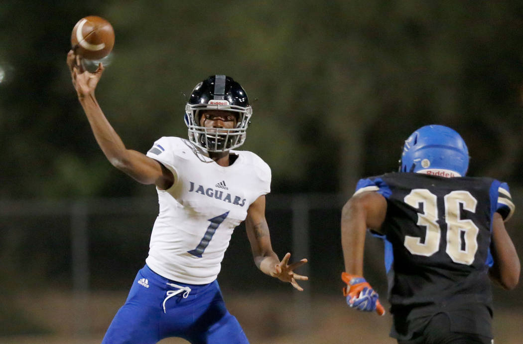 Desert Pines’ quarterback Tyler Williamson (1) throws against Sierra Vista’s Jav ...