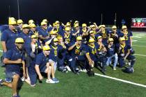 Boulder City football players celebrate their 27-20 home victory over Virgin Valley on Thurs ...