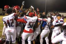 Valley football players celebrate their 46-3 victory over Western at Western High School on ...
