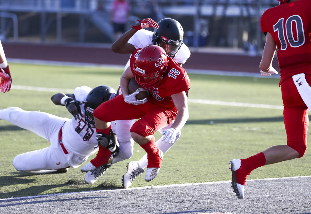 Arbor View Aggies running back/safety Justin Hausner (13) runs the ball into the end zone fo ...