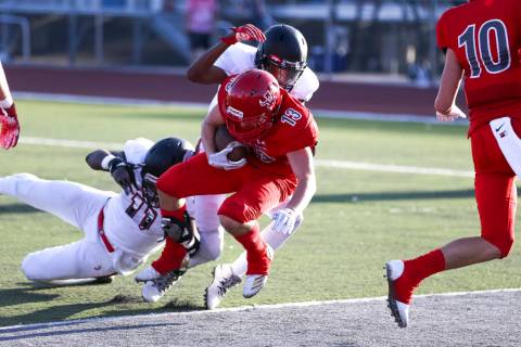 Arbor View Aggies running back/safety Justin Hausner (13) runs the ball into the end zone fo ...