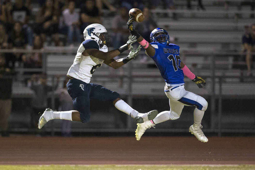 Basic’s Franco Mays Jr. (10), right, deflects a pass intended for Foothill’s Jor ...
