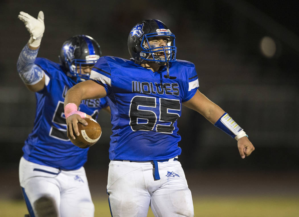 Basic defensive end Julio Duron (65) celebrates after recovering a fumble against Foothill d ...