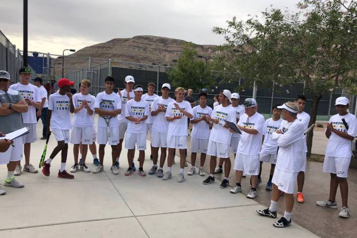 Palo Verde boy’s tennis players accept congratulations from an NIAA official after a 1 ...