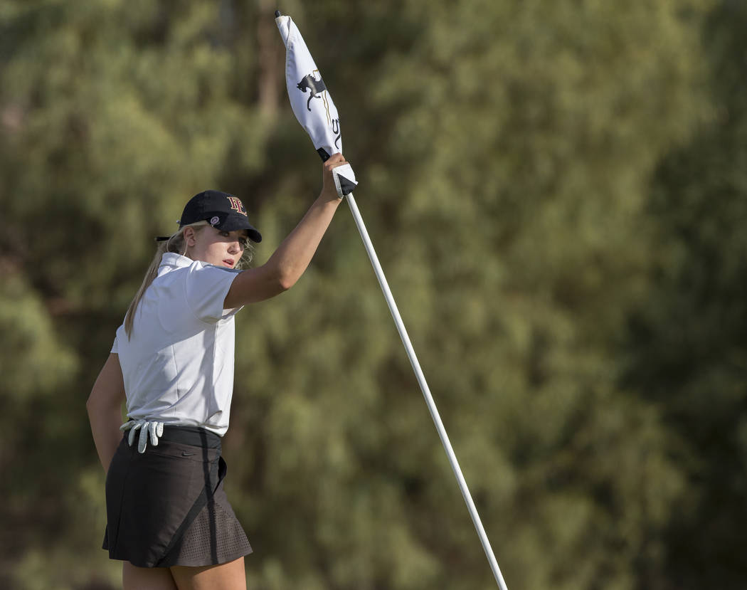 Faith Lutheran sophomore Gracie Olkowski pulls the flag after reaching the green at Stallion ...