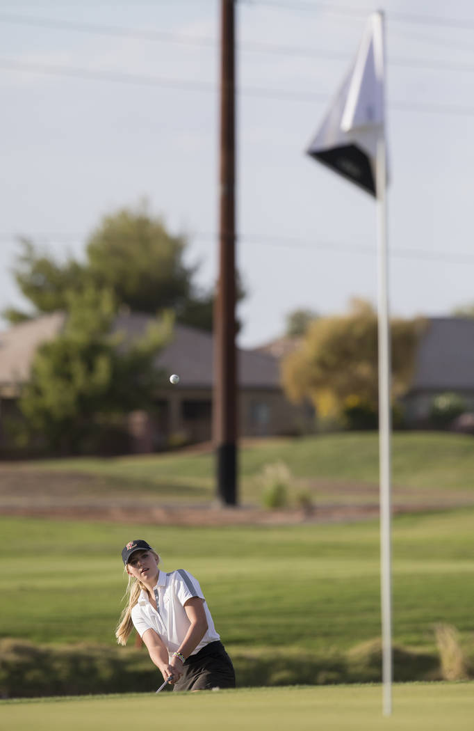 Faith Lutheran sophomore Gracie Olkowski chips onto the green at Stallion Mountain Golf Club ...