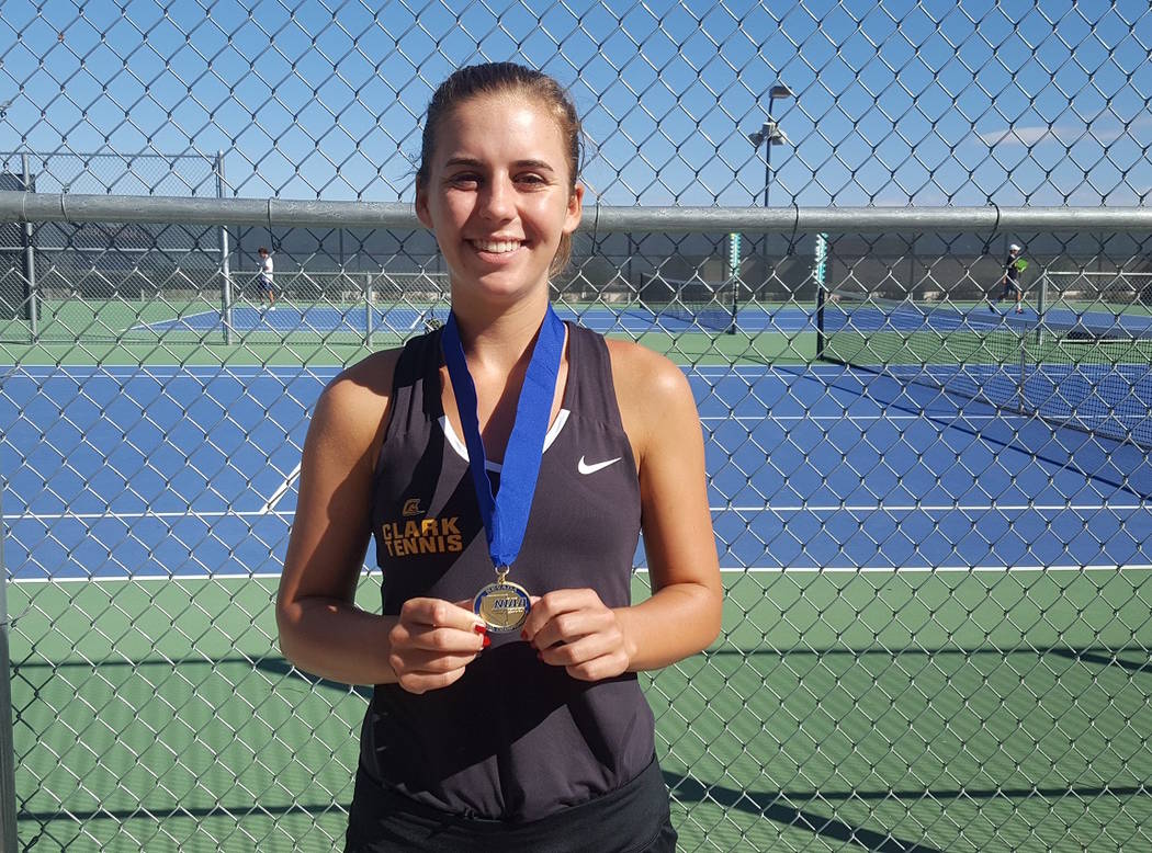 Clark junior Audrey Boch-Collins poses with her championship medal after defeating Bishop Go ...