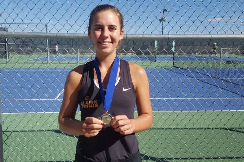 Clark junior Audrey Boch-Collins poses with her championship medal after defeating Bishop Go ...