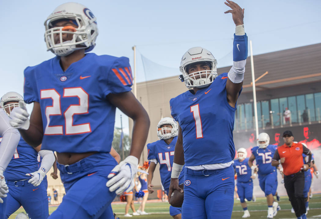 Bishop Gorman junior quarterback Micah Bowens (1) salutes the crowd as the Gaels take the fi ...