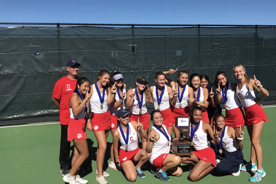 Coronado’s girls tennis team poses for a photo with the Class 4A state championship tr ...