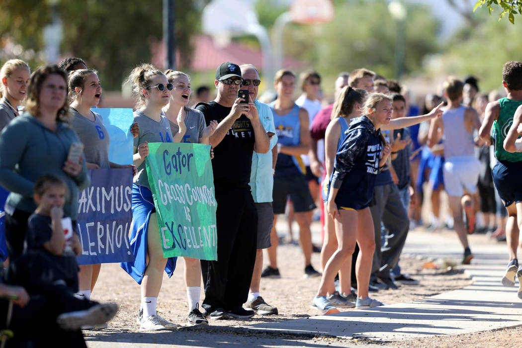 Fans cheer during the 4A Desert boys cross country region race at Veteran’s Memorial P ...