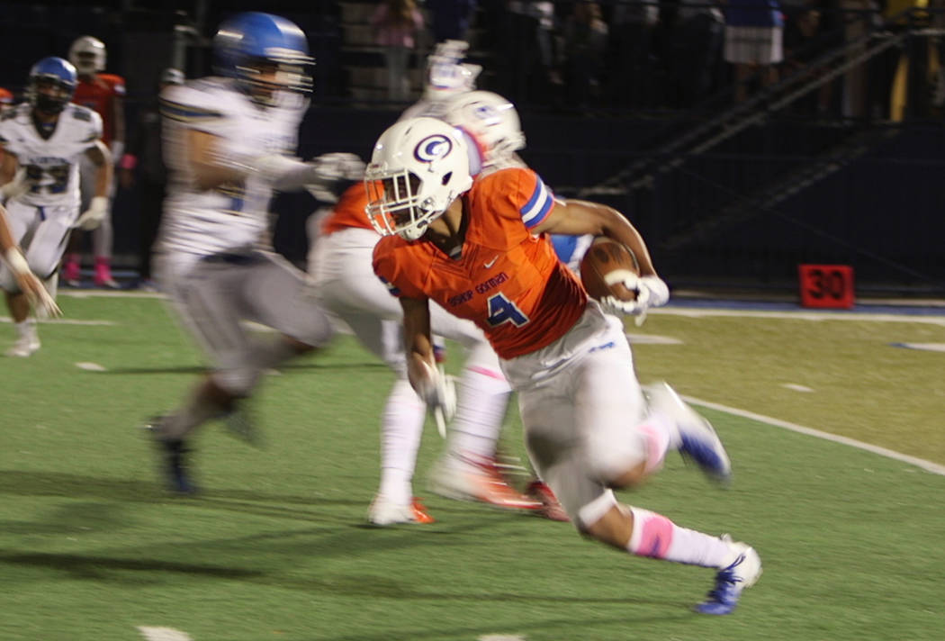 Rome Odunze of Bishop Gorman carries the ball. Bishop Gorman defeats Sierra Vista 62-7, in h ...