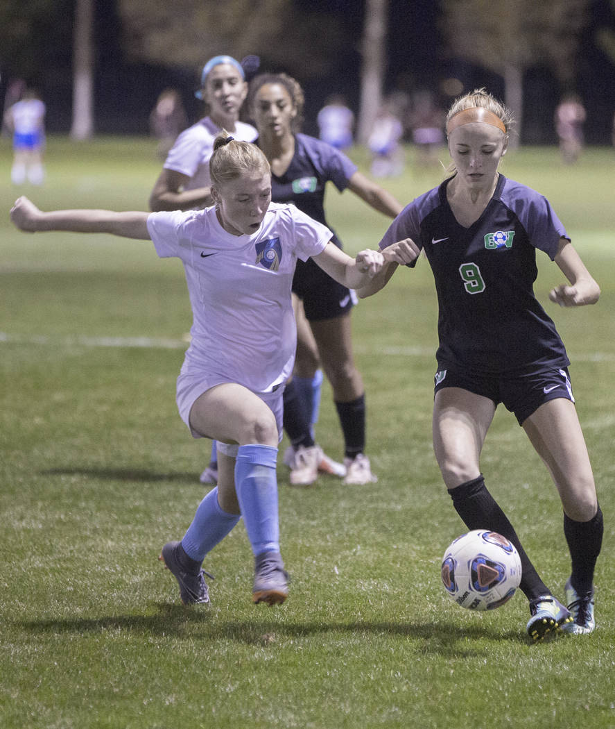Foothill junior Haley Huff (2) fights for a loose ball Green Valley junior midfielder Grace ...