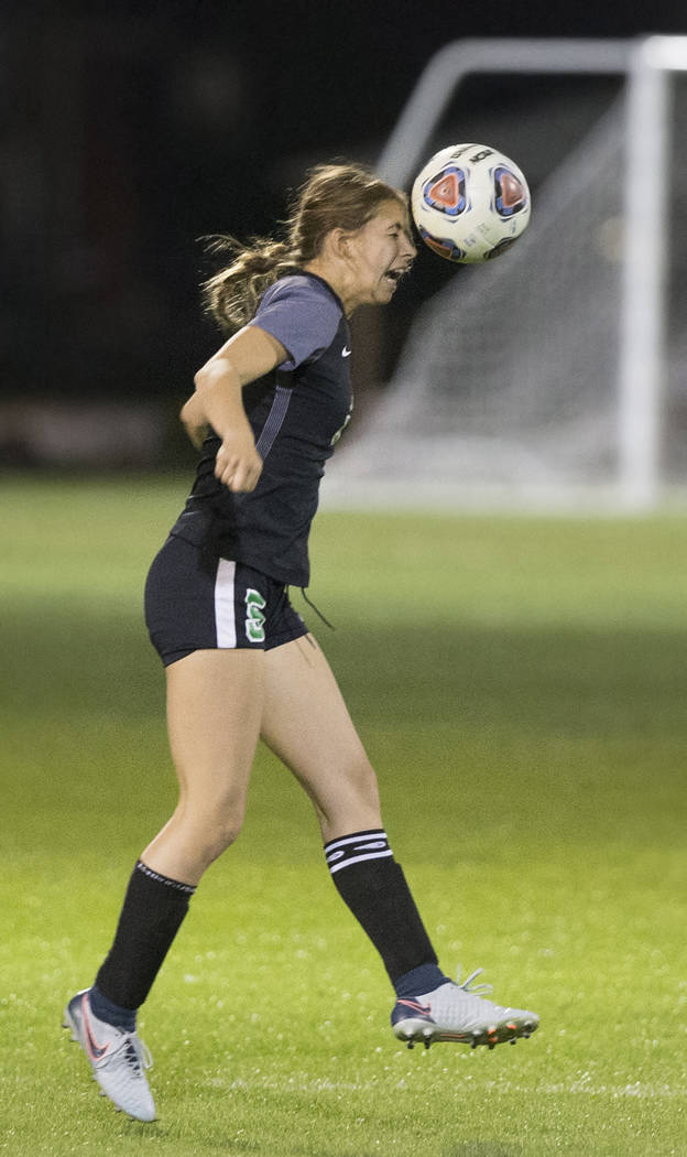 Green Valley junior midfielder Savannah Newman (5) heads a ball during the Gators game with ...