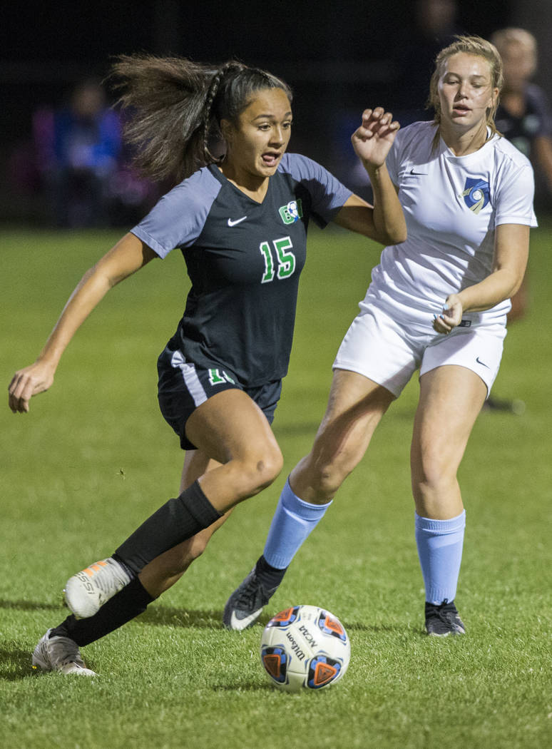 Green Valley junior forward Jazlyn Camacho (15) pushes the ball up field past Foothill senio ...