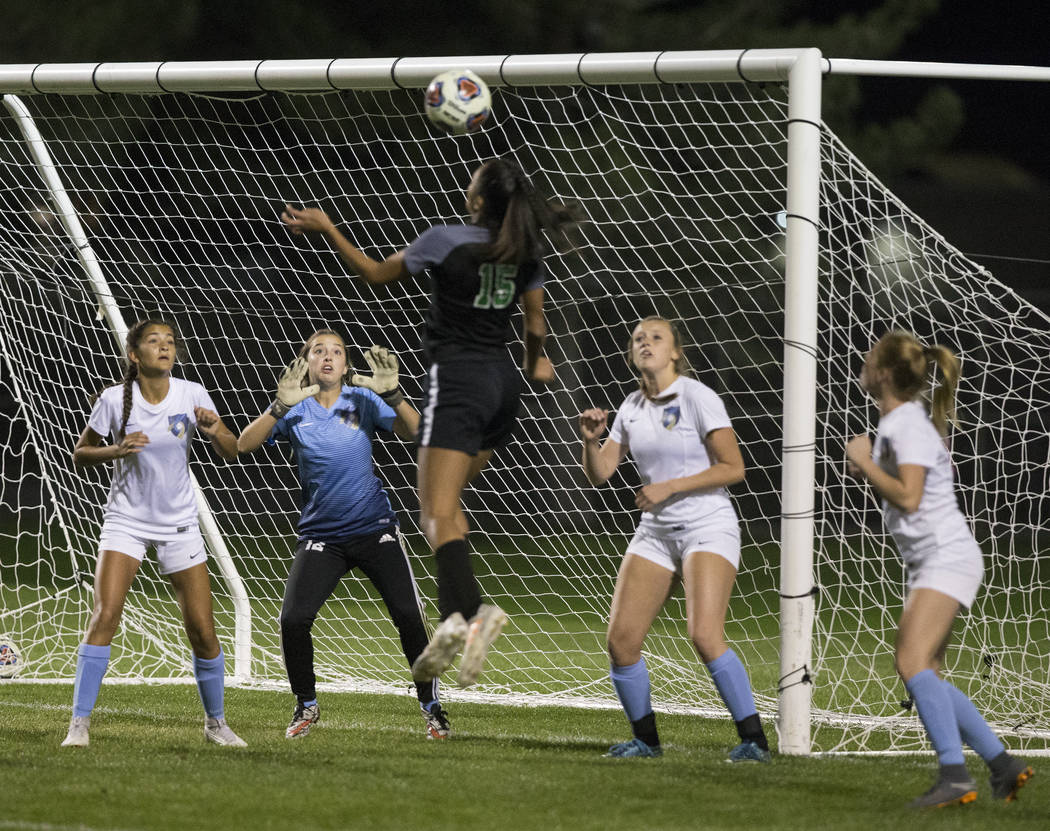 Green Valley junior forward Jazlyn Camacho (15) goes up for a header against Foothill High S ...