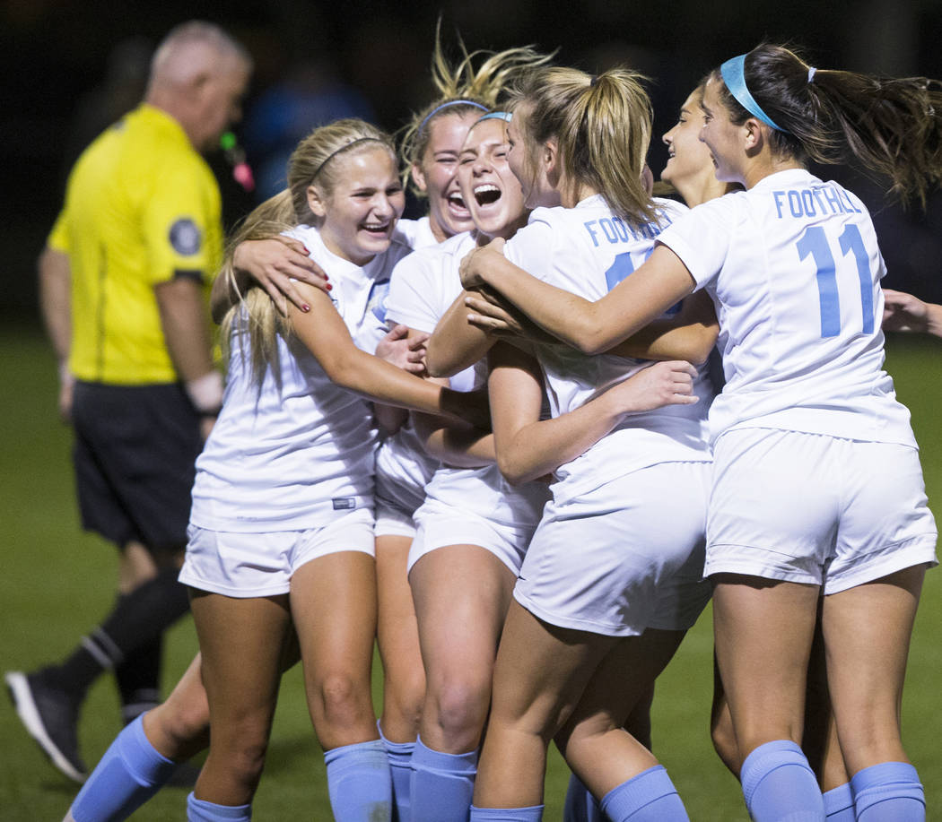 Foothill High School players celebrate after scoring a last second goal in the second half t ...
