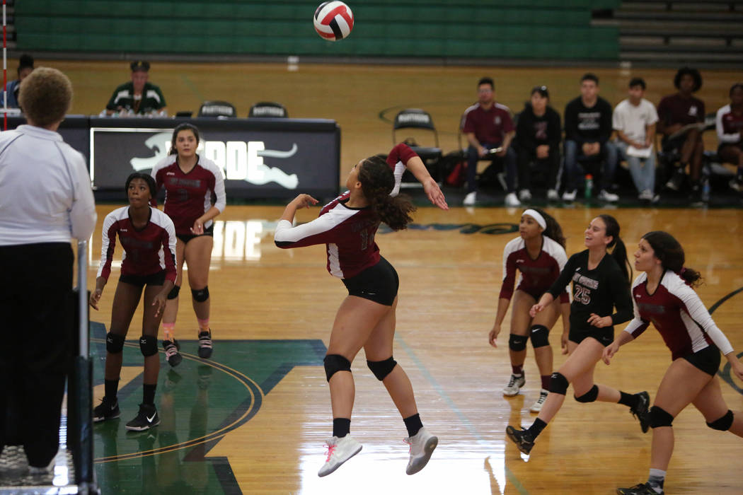 Cimarron Memorial High School’s Tia Hayes jumps up to hit the ball during a game again ...