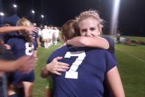 Centennial seniors Quincy Bonds and Marcella Brooks (7) embrace after the Bulldogs’ 3- ...