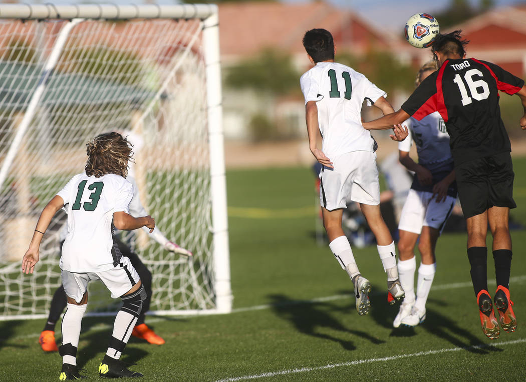 Las Vegas’ Nathan Zamora (16) heads the ball past Palo Verde defenders to score a goal ...