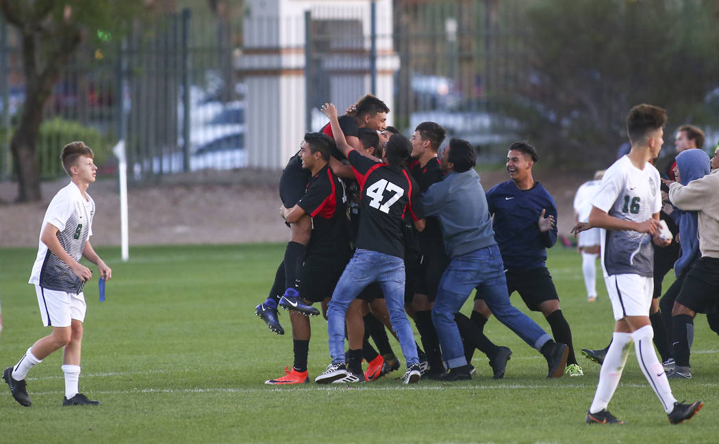 Las Vegas players celebrate their win over Palo Verde in the Mountain Region boys soccer sem ...
