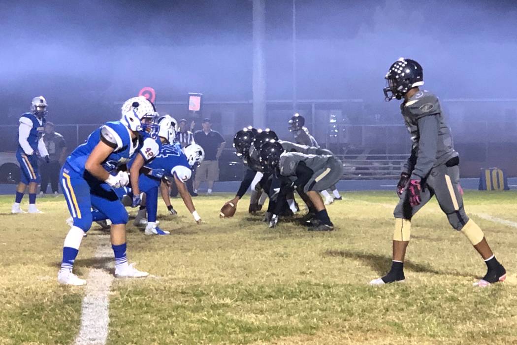 Moapa Valley football players, left, line up against Cheyenne in their Class 3A state quarte ...