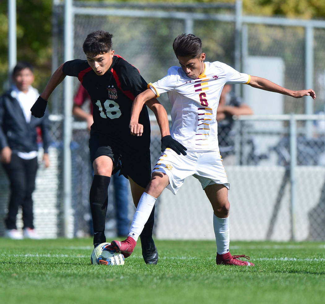 Eldorado High School’s Jesus Espejo (6) challenges Las Vegas High School’s Sergi ...