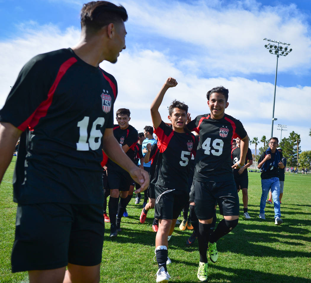 The Las Vegas High School soccer team celebrates winning the the 3A Mountain Region Champion ...