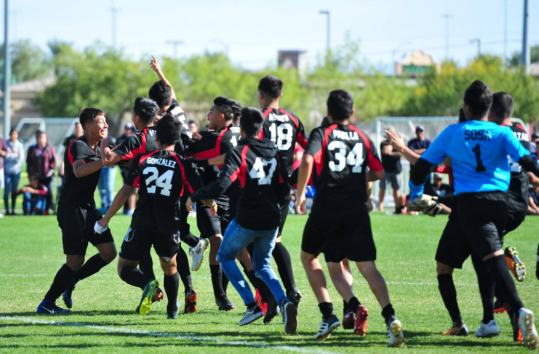 The Las Vegas High School soccer team storms the field after winning the 3A Mountain Region ...