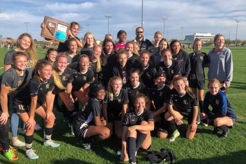 Faith Lutheran’s girls soccer team celebrates winning the Mountain Region championship ...