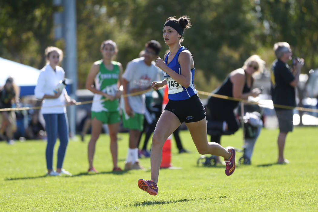 Desert Pines Jazmin Felix (145) makes her way to the finish line for first place during the ...
