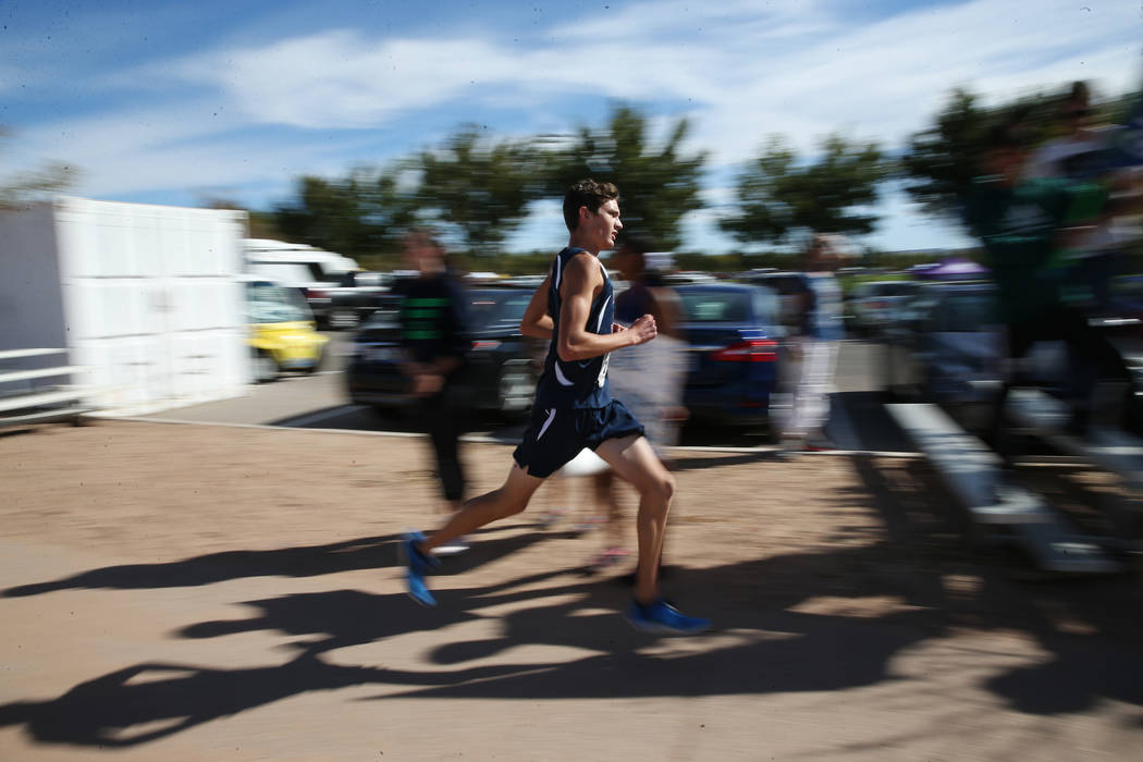 A runner competes during the NIAA 4A Boys Cross Country State Championship at the Veteran&#8 ...