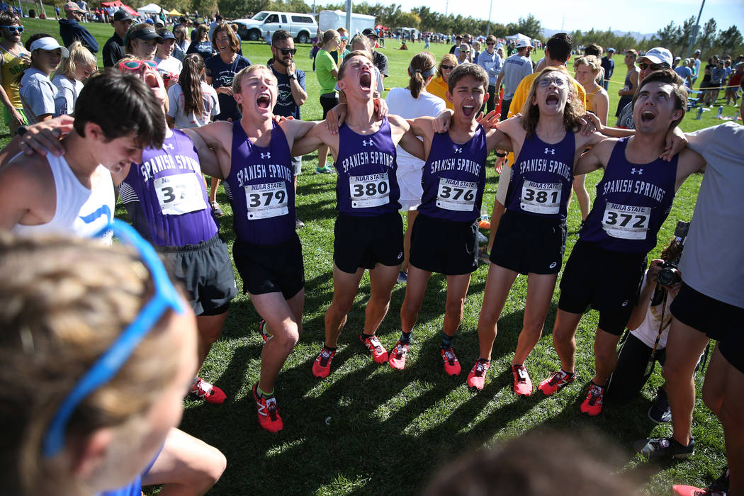 Runners from Spanish Springs High School in Washoe County yell a chant as they get ready to ...