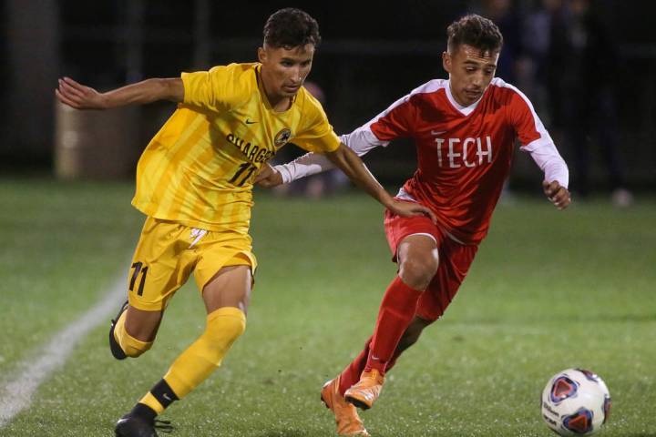 Clark High School’s Juan Beltran Diaz fights for the ball against Advanced Technologie ...