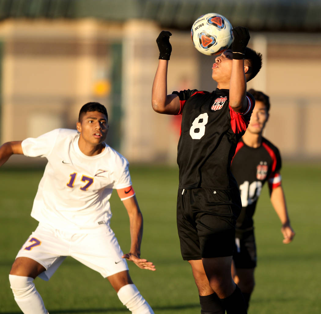 Las Vegas’ Daniel Rangel (8) heads the ball in front of Durango’s Marcos Delgado ...