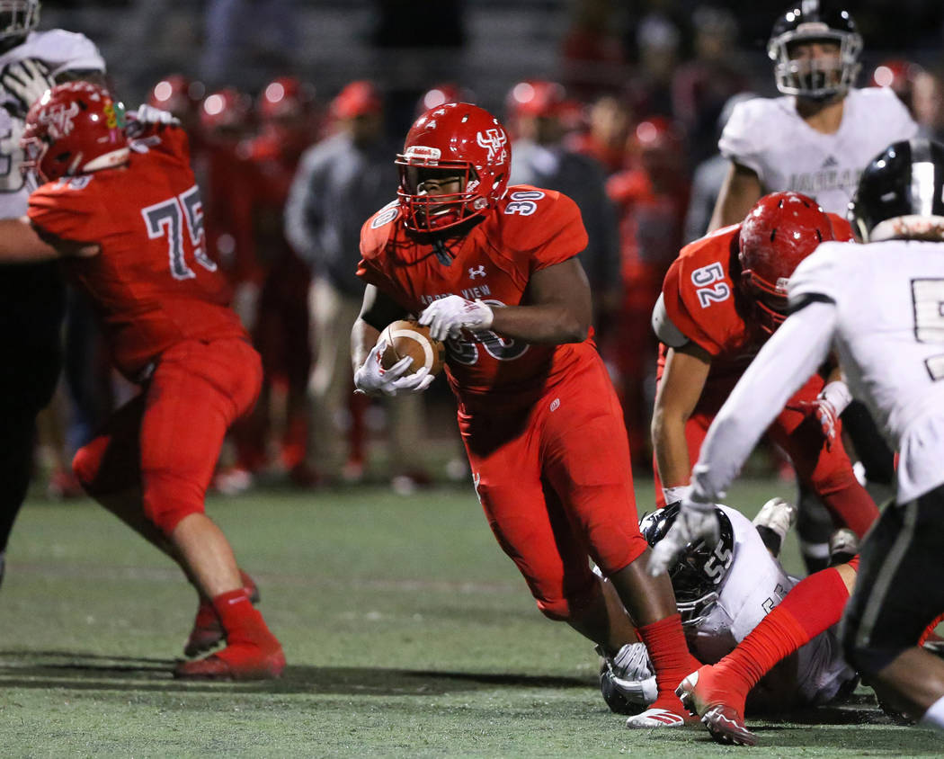 Arbor View’s Darius Williams (30) runs through a pocket during second half of the Moun ...