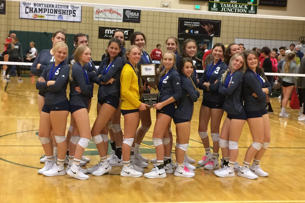 Boulder City’s girls volleyball team poses after winning the Class 3A state championsh ...