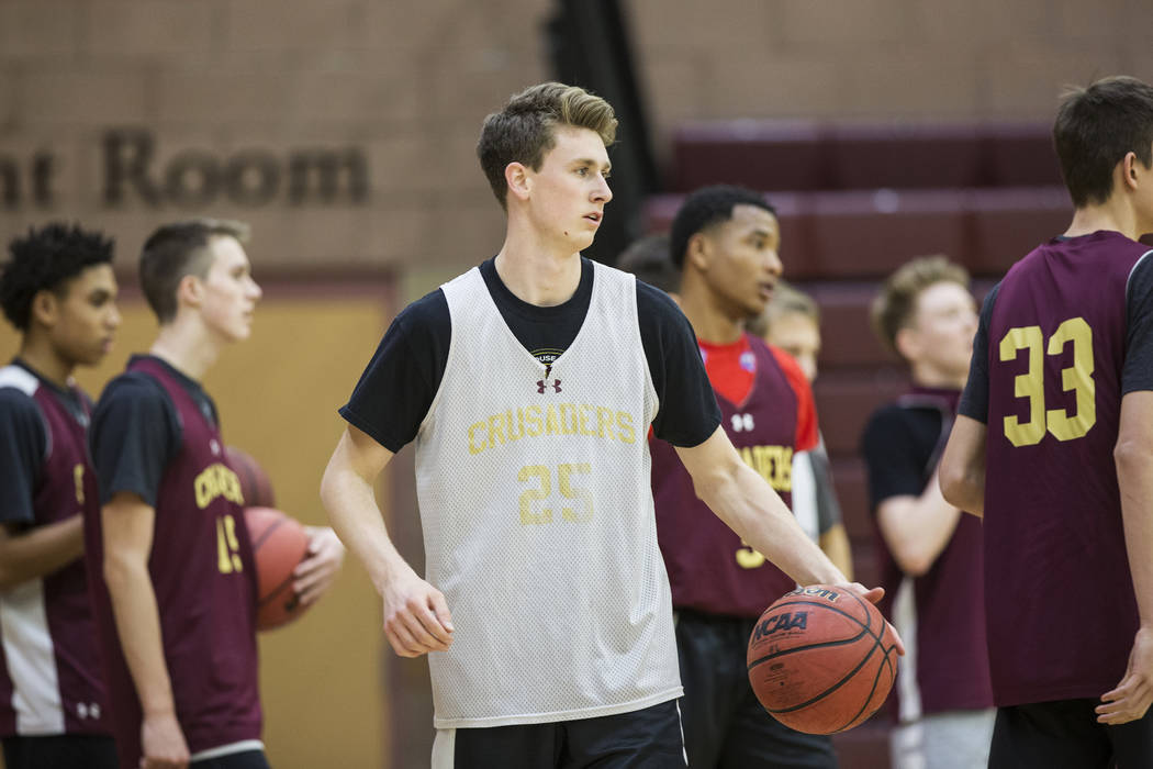 Faith Lutheran senior guard Brevin Walter, middle, runs through a drill during practice on M ...