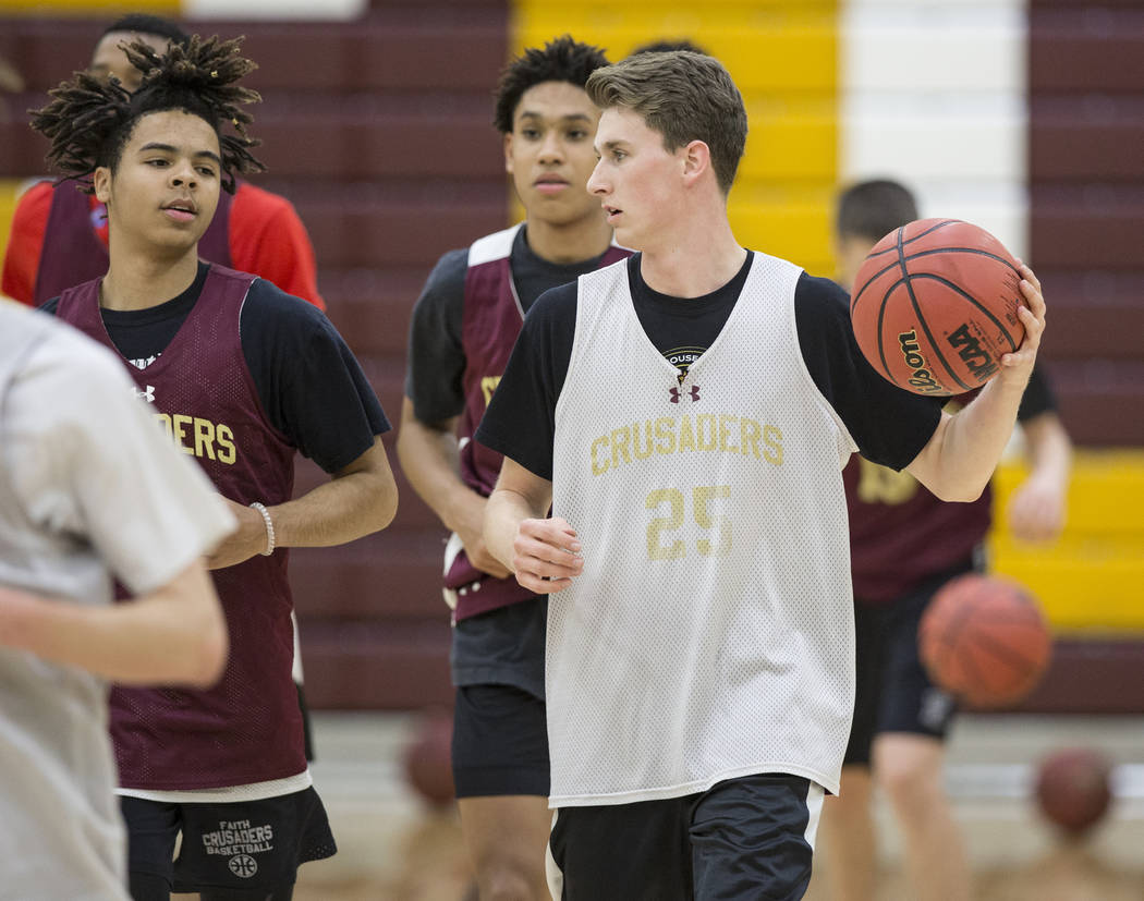 Faith Lutheran senior guard Brevin Walter, right, runs through a drill during practice on Mo ...