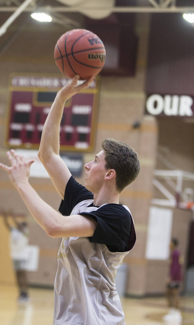 Faith Lutheran senior guard Brevin Walter runs through a layup drill during practice on Mond ...