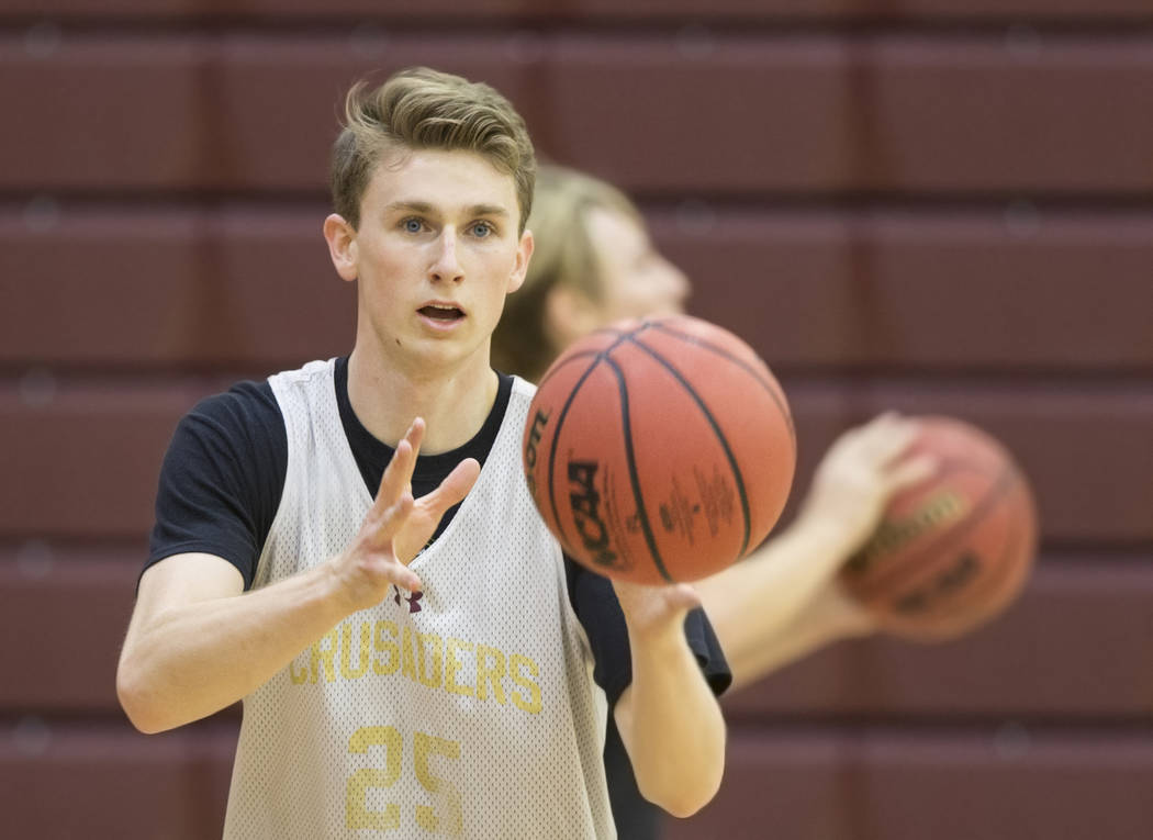 Faith Lutheran senior guard Brevin Walter runs through a shooting drill during practice on M ...