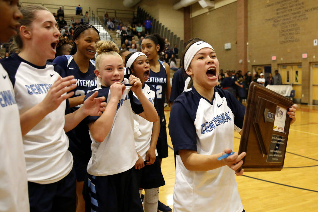 Centennial’s Melanie Isbell, right, celebrates with her team after beating Spring Vall ...