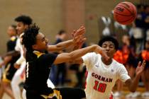 Clark’s Frankie Collins (1) defends against Bishop Gorman’s Zaon Collins (10) d ...