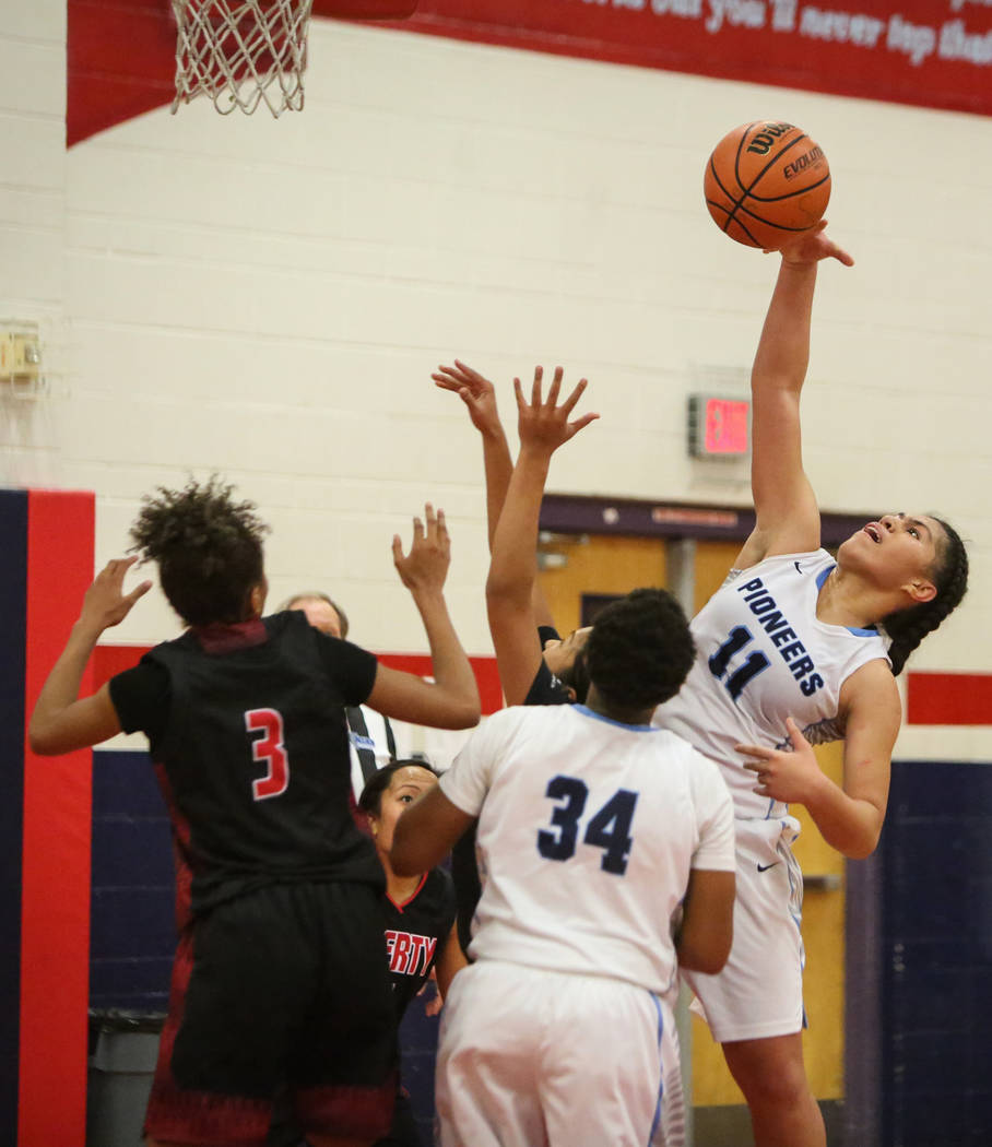 Canyon Springs’ Jeanette Fine (11) takes a shot during the second half of the Champion ...